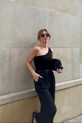a lady wears a black straight pants with black tube top